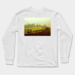 Winding road between fields bathed in sunlight and covered with fog Long Sleeve T-Shirt